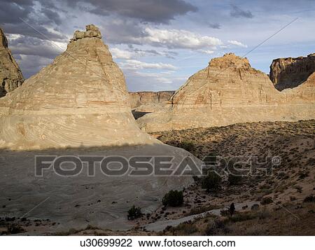 Stock Image - Rock formations on a landscape, Amangiri, Canyon Point, Hoodoo Trail, Utah, USA. Fotosearch