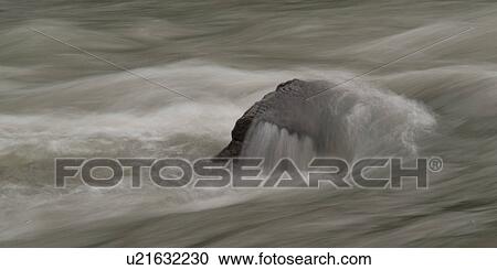Stock Image - Rock in the river, Nairn Falls Provincial Park, British Columbia, Canada. Fotosearch