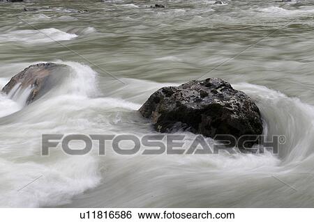 Stock Photograph - Rocks in the river, Nairn Falls Provincial Park, British Columbia, Canada. Fotosearch