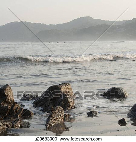 Stock Image - Rocks on the beach, Sayulita, Nayarit, Mexico. Fotosearch