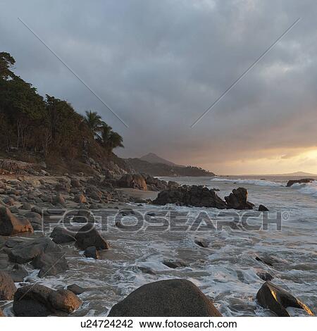 Stock Image - Rocks on the beach, Sayulita, Nayarit, Mexico. Fotosearch