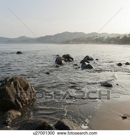 Stock Image - Rocks on the beach, Sayulita, Nayarit, Mexico. Fotosearch