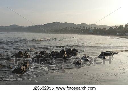 Stock Photography - Rocks on the beach, Sayulita, Nayarit, Mexico. Fotosearch