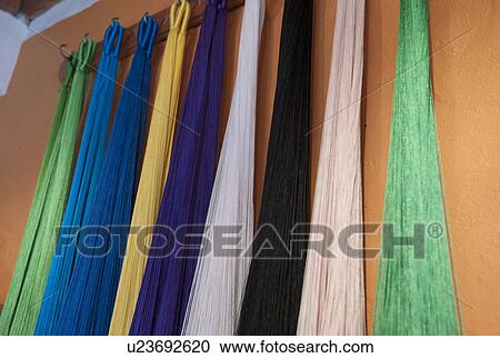 Stock Image - Scarves hanging at a market stall, Sayulita, Nayarit, Mexico. Fotosearch