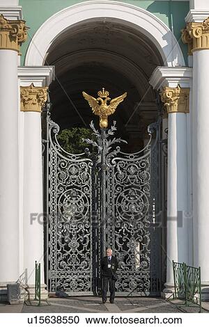 Security officer standing in front of a gate of Winter Palace at State Hermitage Museum, Palace Square, St. Petersburg, Russia View Large Photo Image Stock Image - Security officer standing in front of a gate of Winter Palace at State Hermitage Museum, Palace Square, St. Petersburg, Russia. Fotosearch