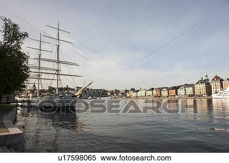 Ship at a dock with buildings in the background, Gamla Stan, Stockholm, Sweden View Large Photo Image Stock Photography - Ship at a dock with buildings in the background, Gamla Stan, Stockholm, Sweden. Fotosearch