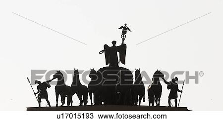 Stock Image - Silhouette of sculptures on a triumphal arch, General Staff Building, Palace Square, St. Petersburg, Russia. Fotosearch