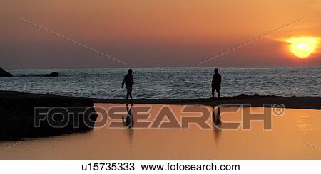Silhouette of two people on the beach at sunset, Sayulita, Nayarit, Mexico View Large Photo Image Stock Image - Silhouette of two people on the beach at sunset, Sayulita, Nayarit, Mexico. Fotosearch