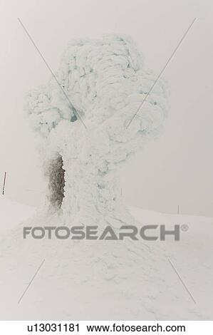 Stock Image - Snow covered Inuksuk, Whistler Mountain, Whistler, British Columbia, Canada. Fotosearch