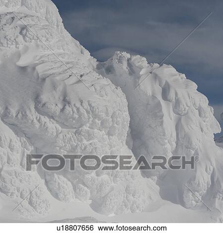 Stock Photograph - Snow covered rocks, Whistler, British Columbia, Canada. Fotosearch