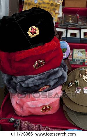 Stock Photograph - Souvenir hats at a market stall, St. Isaac's Square, St. Petersburg, Russia. Fotosearch