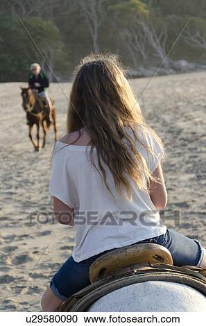 Teenage girl riding a horse on the beach, Sayulita, Nayarit, Mexico View Large Photo Image Stock Image - Teenage girl riding a horse on the beach, Sayulita, Nayarit, Mexico. Fotosearch