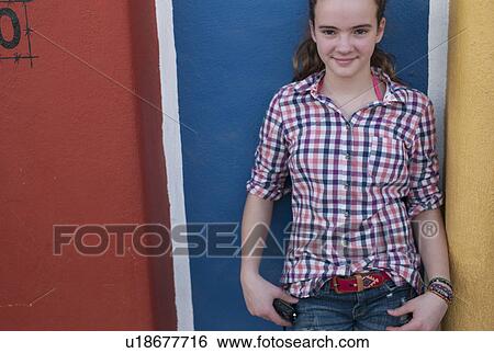 Teenage girl standing in front of a painted wall, Sayulita, Nayarit, Mexico View Large Photo Image Stock Photograph - Teenage girl standing in front of a painted wall, Sayulita, Nayarit, Mexico. Fotosearch