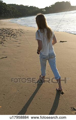 Teenage girl walking on the beach, Sayulita, Nayarit, Mexico View Large Photo Image Picture - Teenage girl walking on the beach, Sayulita, Nayarit, Mexico. Fotosearch