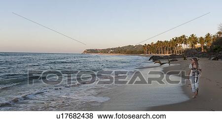 Stock Photo - Teenage girl walking on the beach, Sayulita, Nayarit, Mexico. Fotosearch