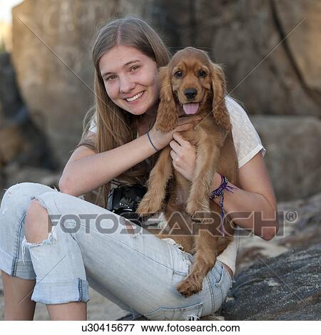 Stock Photo - Teenage girl with a dog, Sayulita, Nayarit, Mexico. Fotosearch