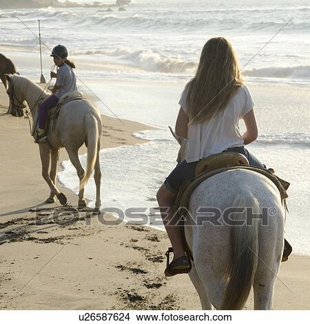 Teenage girls riding horses on the beach, Sayulita, Nayarit, Mexico View Large Photo Image Picture - Teenage girls riding horses on the beach, Sayulita, Nayarit, Mexico. Fotosearch