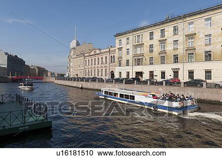 Stock Image - Tourboats in the Moyka River, St. Petersburg, Russia. Fotosearch