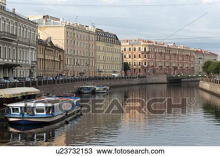 Stock Image - Tourboats in the Moyka River, St. Petersburg, Russia. Fotosearch