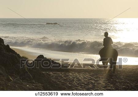 Tourist riding horse on the beach, Sayulita, Nayarit, Mexico View Large Photo Image Stock Photo - Tourist riding horse on the beach, Sayulita, Nayarit, Mexico. Fotosearch