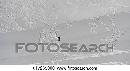 Stock Image - Tourist skiing, Sun Bowl, Whistler, British Columbia, Canada. Fotosearch