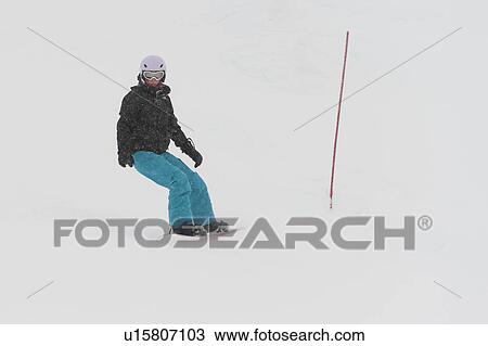 Stock Image - Tourist snowboarding, Whistler Mountain, Whistler, British Columbia, Canada. Fotosearch