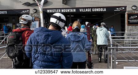 Stock Photo - Tourists at a ski resort, Whistler, British Columbia, Canada. Fotosearch