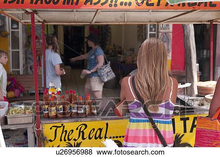 Stock Photo - Tourists at food stall, Sayulita, Nayarit, Mexico. Fotosearch
