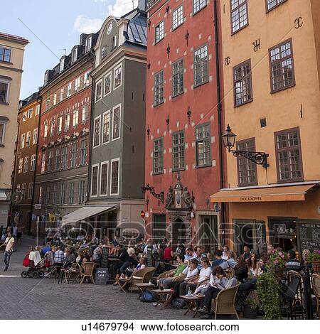 Tourists at outdoor cafes on a street, Gamla Stan, Stockholm, Sweden View Large Photo Image Picture - Tourists at outdoor cafes on a street, Gamla Stan, Stockholm, Sweden. Fotosearch