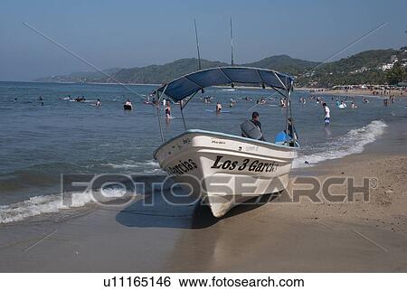 Tourists enjoying on the beach, Sayulita, Nayarit, Mexico View Large Photo Image Stock Photograph - Tourists enjoying on the beach, Sayulita, Nayarit, Mexico. Fotosearch