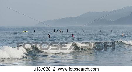Tourists enjoying surfing in the sea, Sayulita, Nayarit, Mexico View Large Photo Image Stock Image - Tourists enjoying surfing in the sea, Sayulita, Nayarit, Mexico. Fotosearch