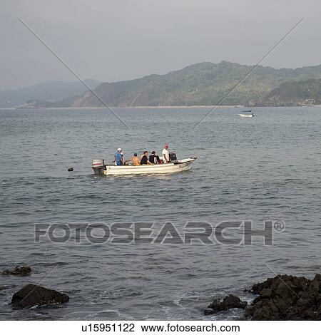 Tourists in a motorboat, Sayulita, Nayarit, Mexico View Large Photo Image Stock Image - Tourists in a motorboat, Sayulita, Nayarit, Mexico. Fotosearch