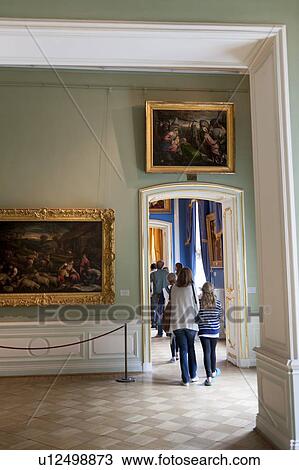Stock Image - Tourists in a museum, Winter Palace, State Hermitage Museum, Palace Square, St. Petersburg, Russia. Fotosearch