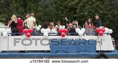 Stock Image - Tourists on a tourboat, St. Petersburg, Russia. Fotosearch