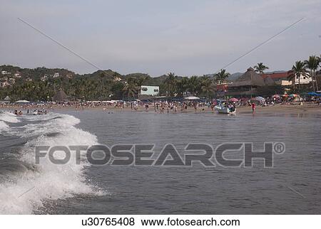 Stock Photo - Tourists on the beach, Sayulita, Nayarit, Mexico. Fotosearch