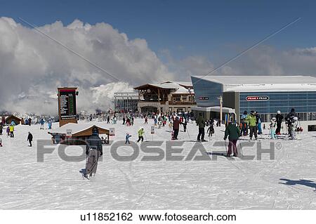 Tourists skiing near Peak 2 Peak Gondola terminal, Whistler, British Columbia, Canada View Large Photo Image Stock Image - Tourists skiing near Peak 2 Peak Gondola terminal, Whistler, British Columbia, Canada. Fotosearch