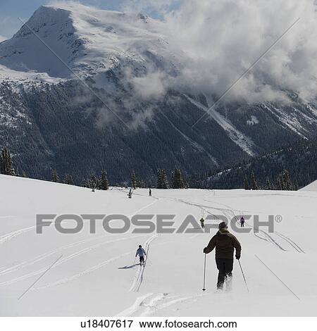 Stock Photo - Tourists skiing, Whistler, British Columbia, Canada. Fotosearch