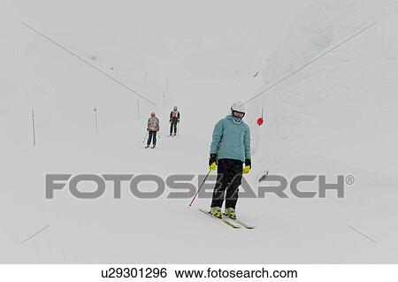 Stock Photograph - Tourists skiing, Whistler Mountain, Whistler, British Columbia, Canada. Fotosearch