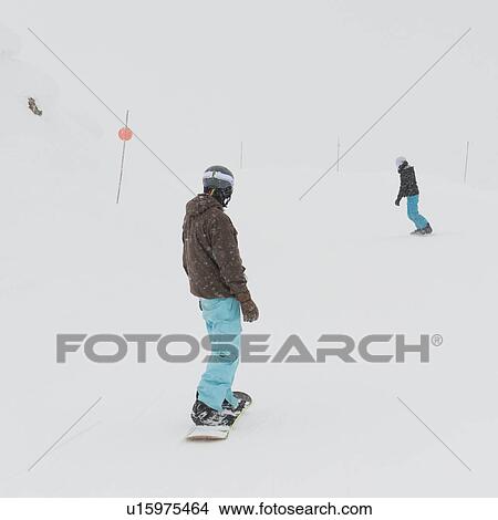 Picture - Tourists snowboarding, Whistler Mountain, Whistler, British Columbia, Canada. Fotosearch