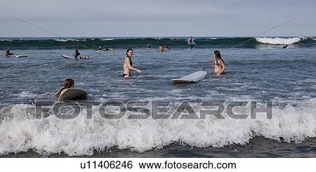 Tourists surfing in the sea, Sayulita, Nayarit, Mexico View Large Photo Image Stock Photograph - Tourists surfing in the sea, Sayulita, Nayarit, Mexico. Fotosearch