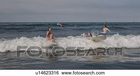 Tourists surfing in the sea, Sayulita, Nayarit, Mexico View Large Photo Image Stock Photograph - Tourists surfing in the sea, Sayulita, Nayarit, Mexico. Fotosearch