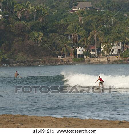 Tourists surfing in the sea, Sayulita, Nayarit, Mexico View Large Photo Image Stock Photography - Tourists surfing in the sea, Sayulita, Nayarit, Mexico. Fotosearch