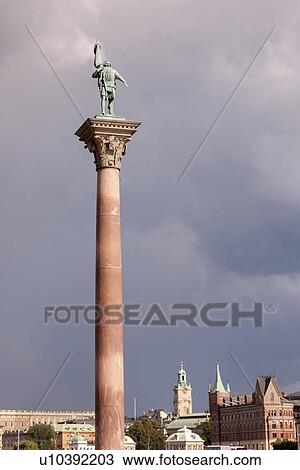 Stock Image - Tower with a city hall in the background, Riddarfjarden, Stockholm, Sweden. Fotosearch