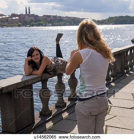 Two female friends in Stockholm city hall, Riddarfjarden, Stockholm, Sweden View Large Photo Image Stock Photography - Two female friends in Stockholm city hall, Riddarfjarden, Stockholm, Sweden. Fotosearch
