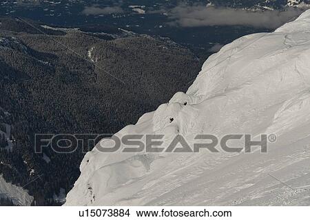 View of a valley from a snow covered mountain, Whistler, British Columbia, Canada View Large Photo Image Picture - View of a valley from a snow covered mountain, Whistler, British Columbia, Canada. Fotosearch