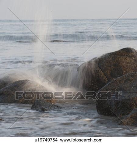 Picture - Waves breaking on rocks, Sayulita, Nayarit, Mexico. Fotosearch