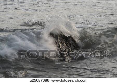 Stock Photograph - Waves breaking on rocks, Sayulita, Nayarit, Mexico. Fotosearch