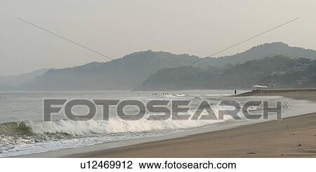 Stock Image - Waves breaking on the beach, Sayulita, Nayarit, Mexico. Fotosearch