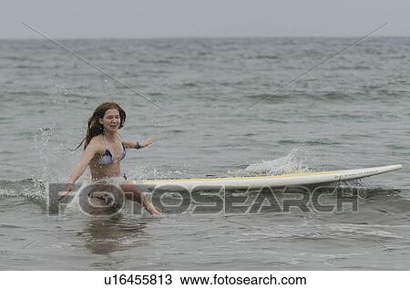 Woman fallen from a surfboard in the sea, Sayulita, Nayarit, Mexico View Large Photo Image Stock Image - Woman fallen from a surfboard in the sea, Sayulita, Nayarit, Mexico. Fotosearch