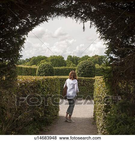 Woman in a palace garden, Drottningholm Palace, Drottningholm, Stockholm County, Sweden View Large Photo Image Stock Photo - Woman in a palace garden, Drottningholm Palace, Drottningholm, Stockholm County, Sweden. Fotosearch